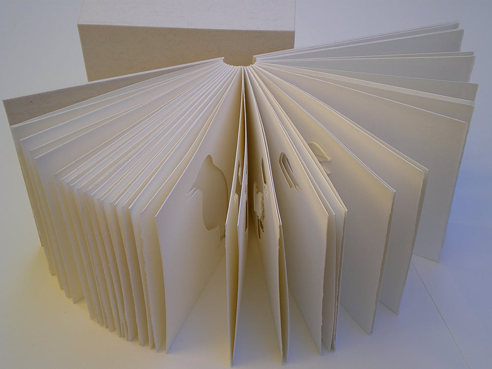 Pages of Three Birds Book that reveal parts of the sculpted birds on each page