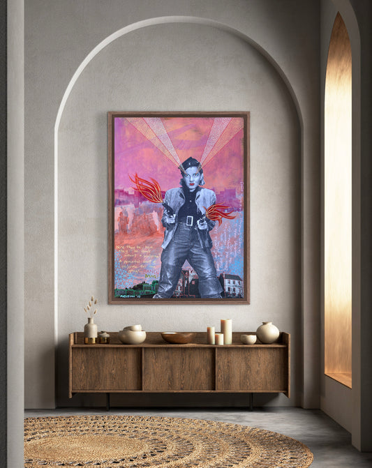 Framed artwork on a wall above a wooden console table with decorative items.