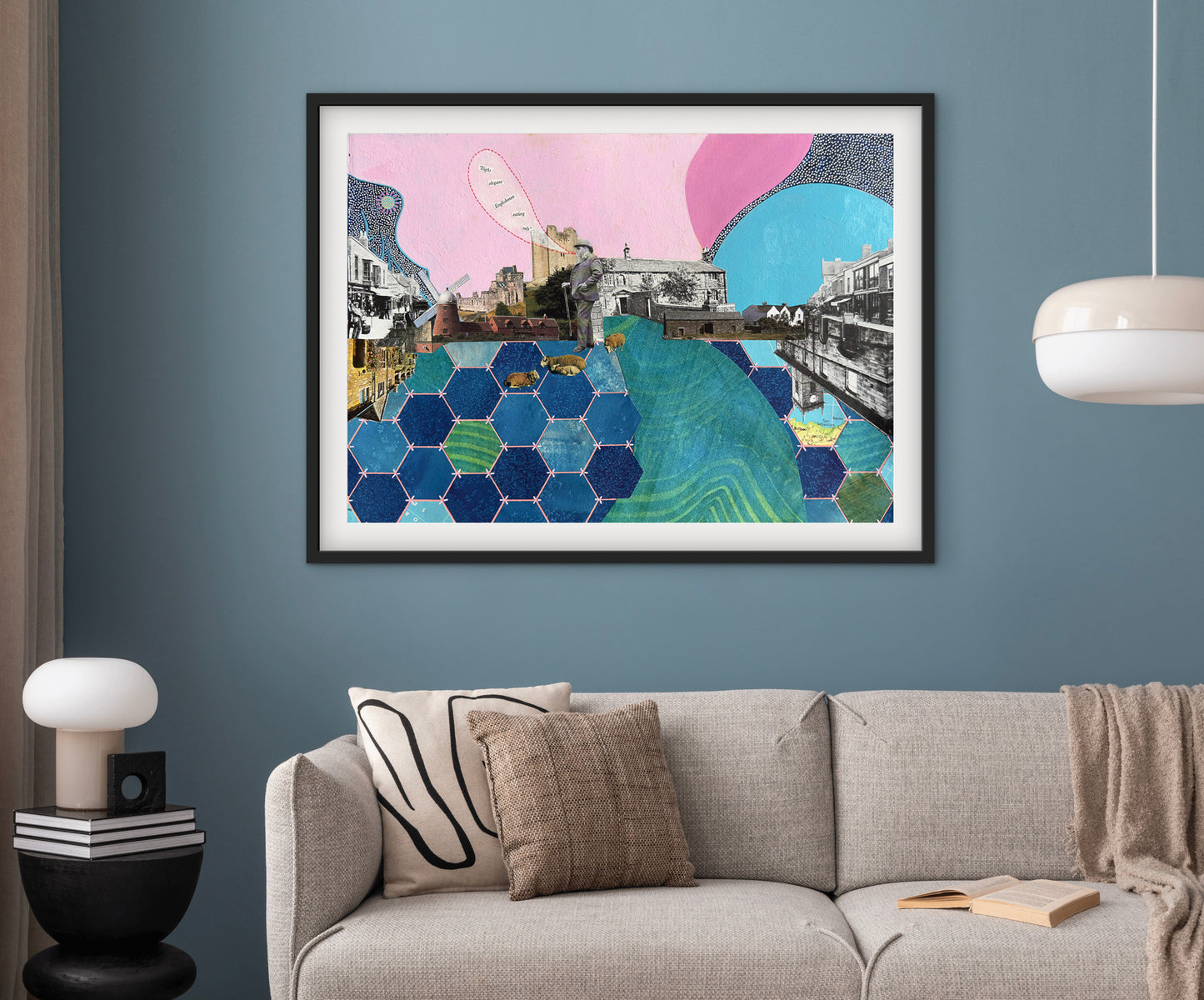 Framed abstract art piece on a wall above a sofa in a living room.