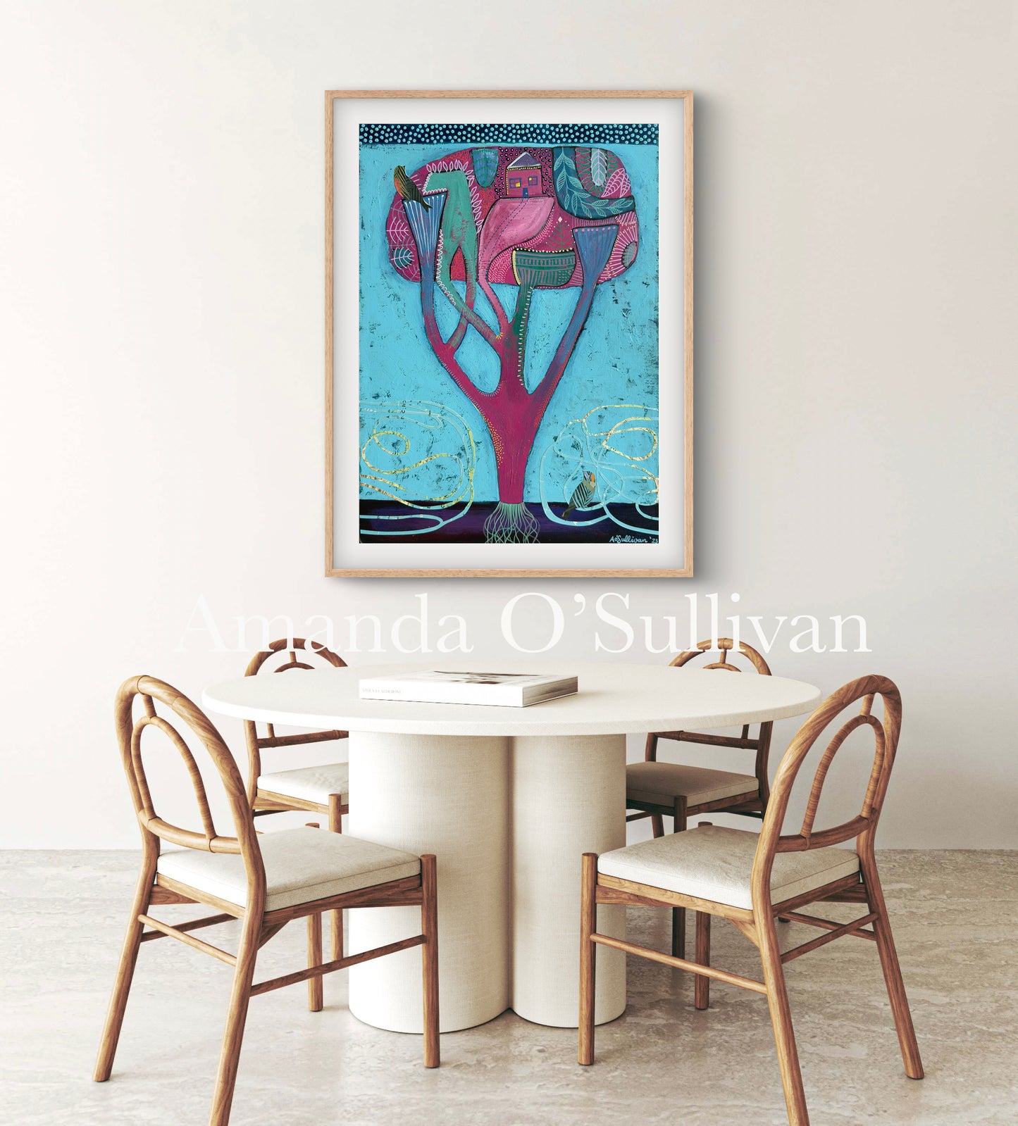 Framed artwork above a dining table with chairs in a room setting.