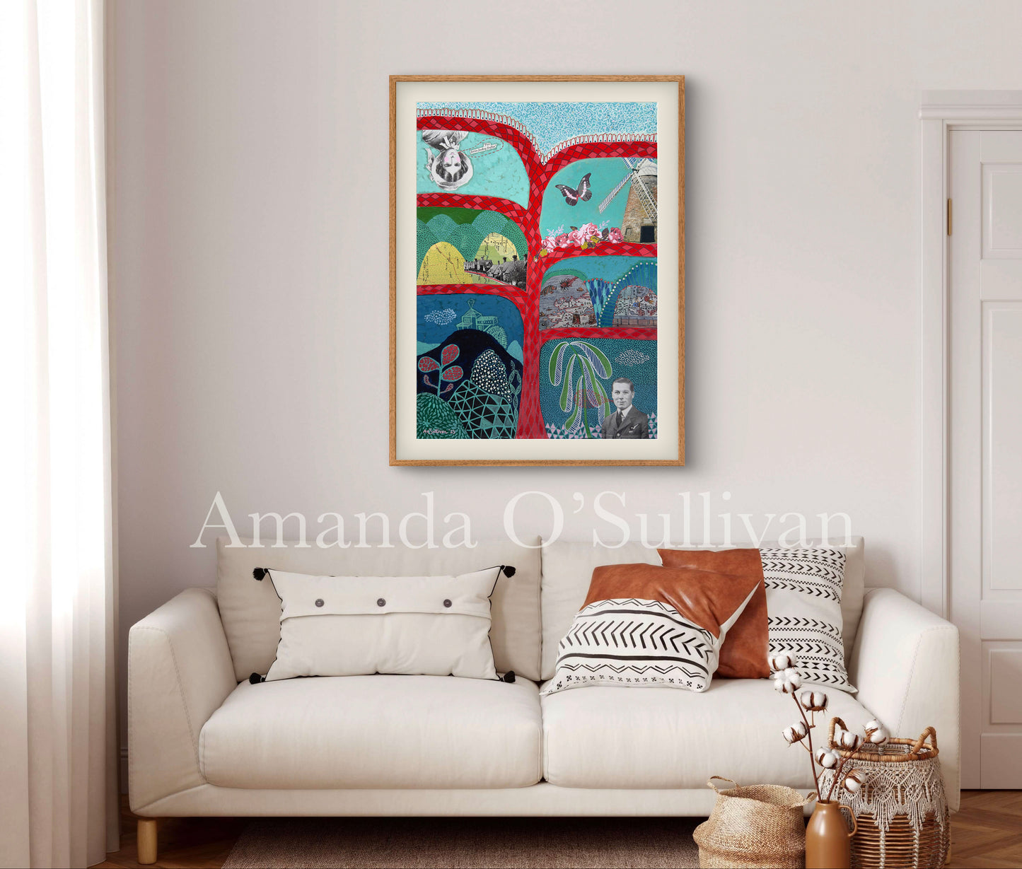 Colorful abstract art piece on a wall above a white sofa with decorative pillows.