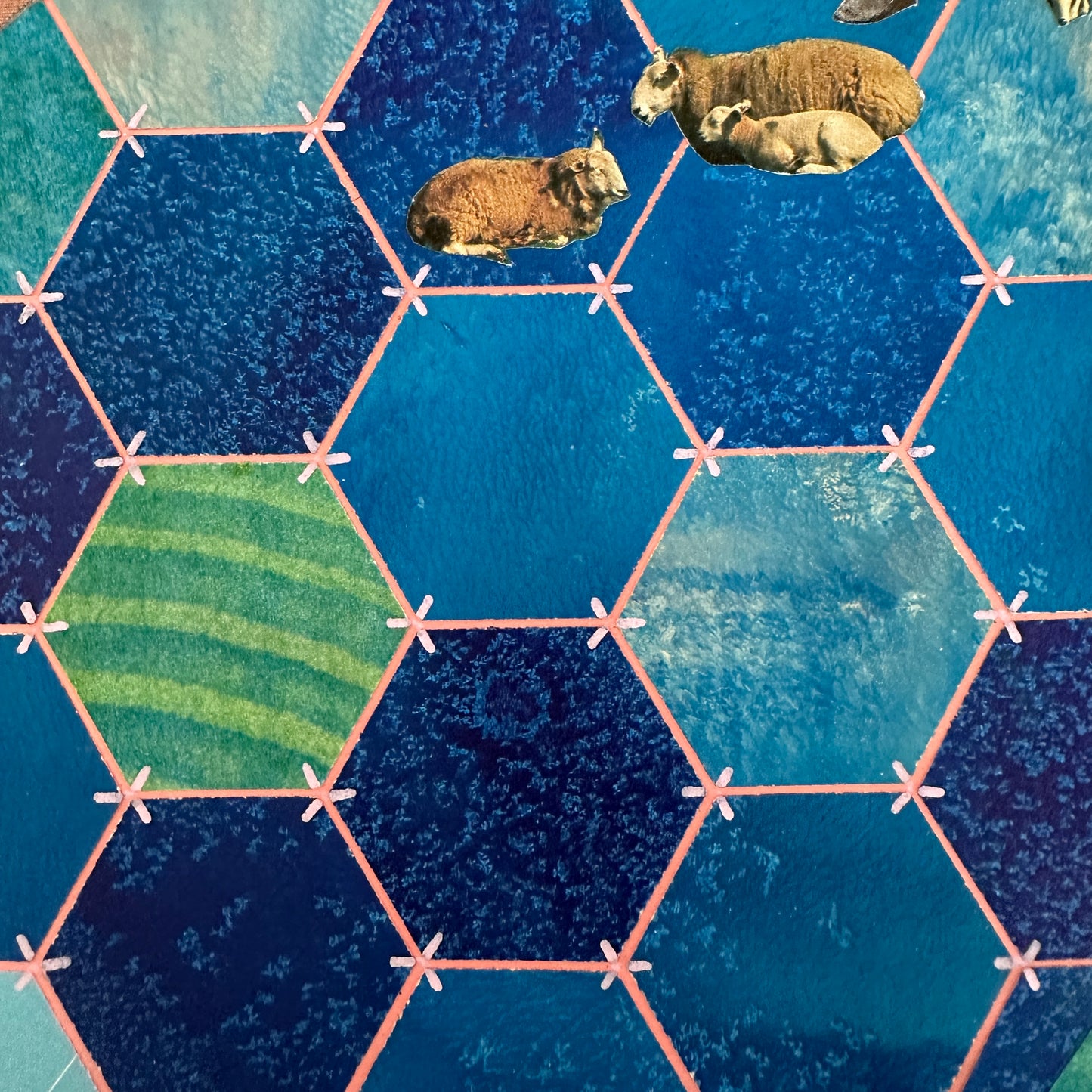 Hexagonal tiles with a blue and green pattern on a textured surface
