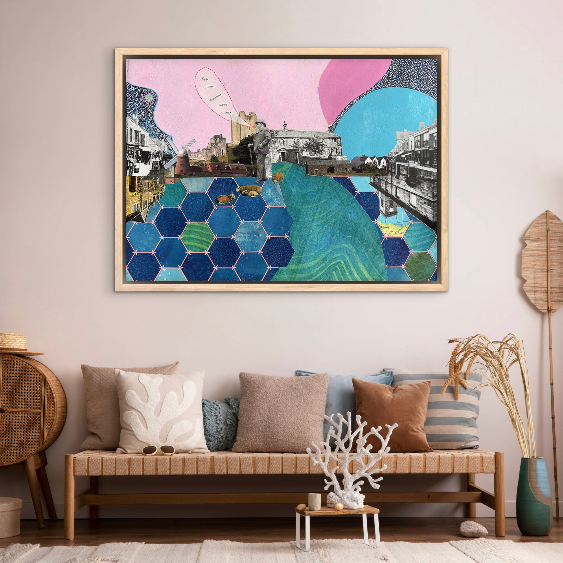 Colorful abstract art piece on a wall above a sofa with decorative pillows.