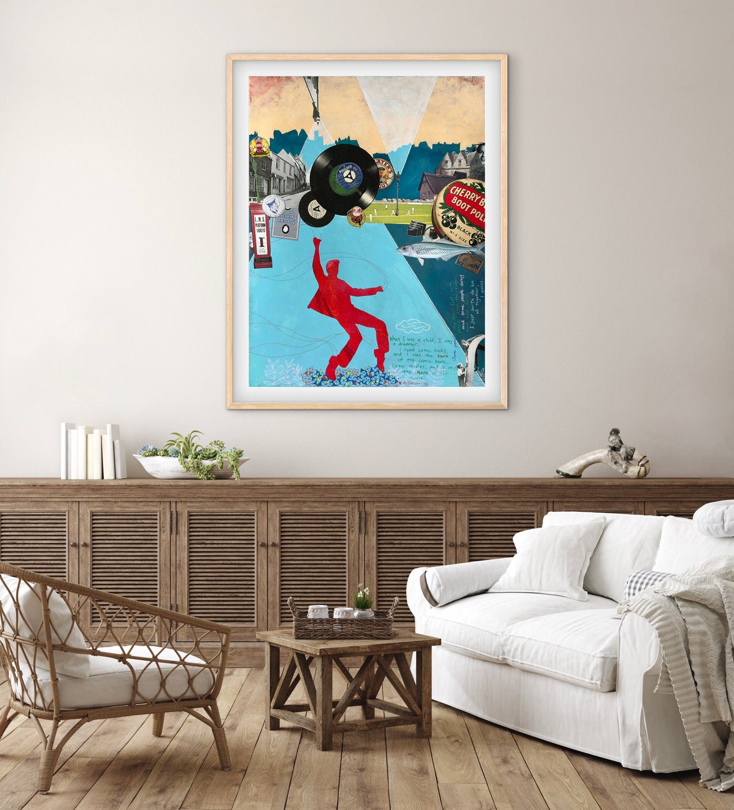 Living room with a colorful framed poster on the wall, white sofa, wooden coffee table, and armchair.