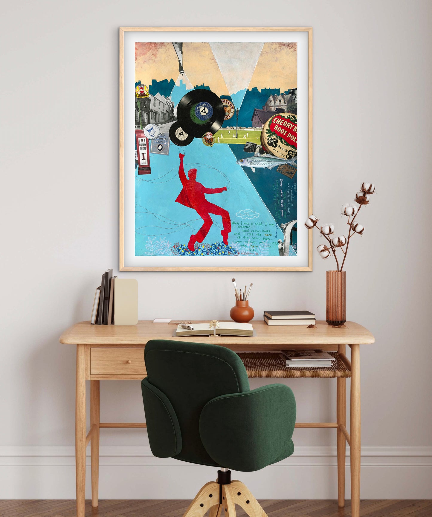 Framed artwork above a desk with a chair in a home office setting
