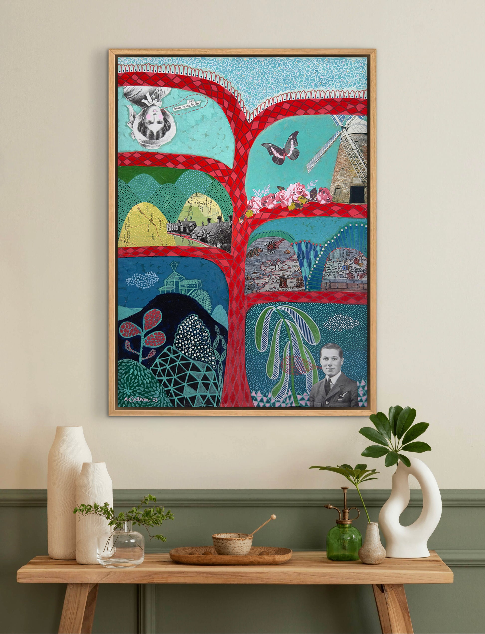 Colorful abstract art piece on a wall above a wooden table with decorative items.