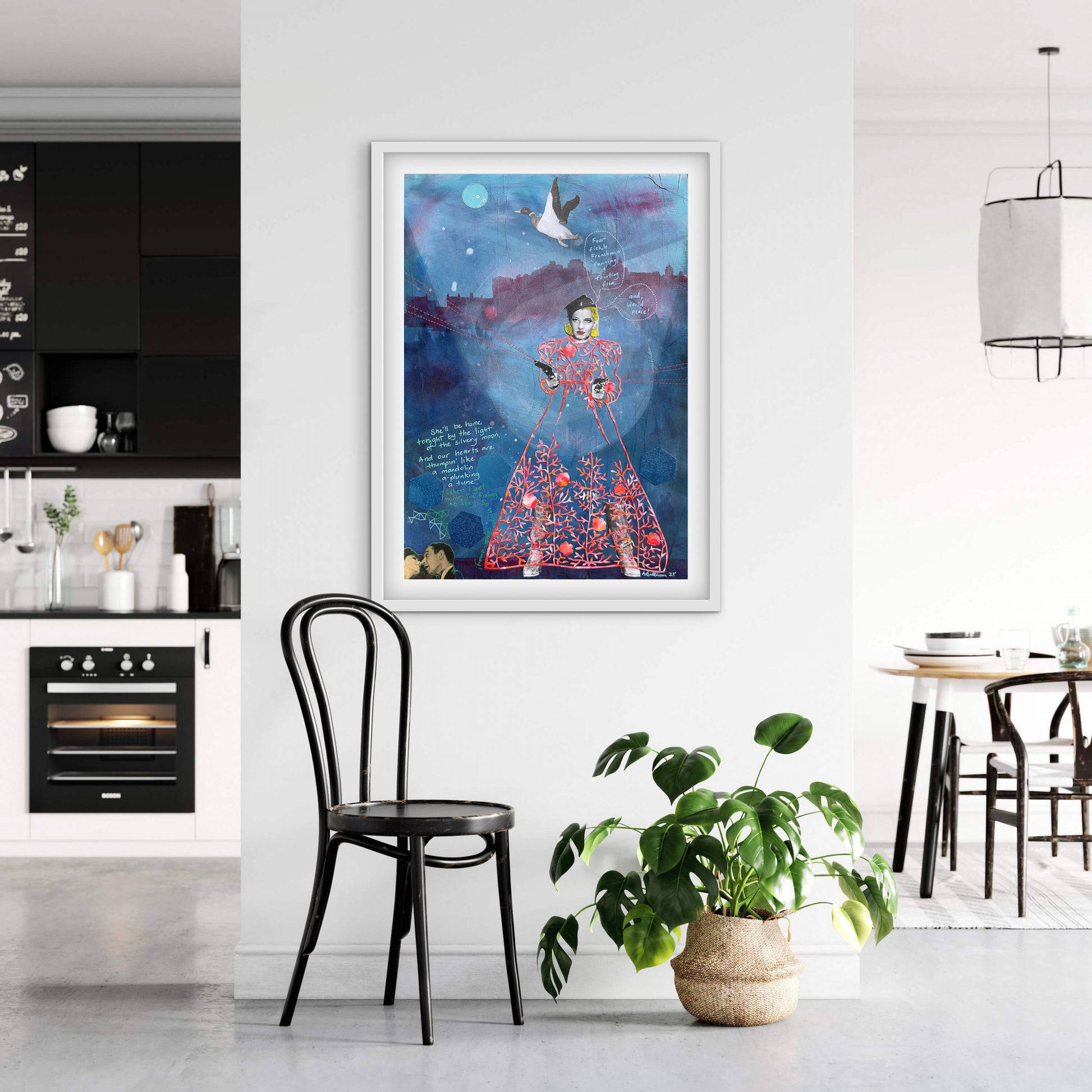 Framed artwork in a modern kitchen with a plant and chair.