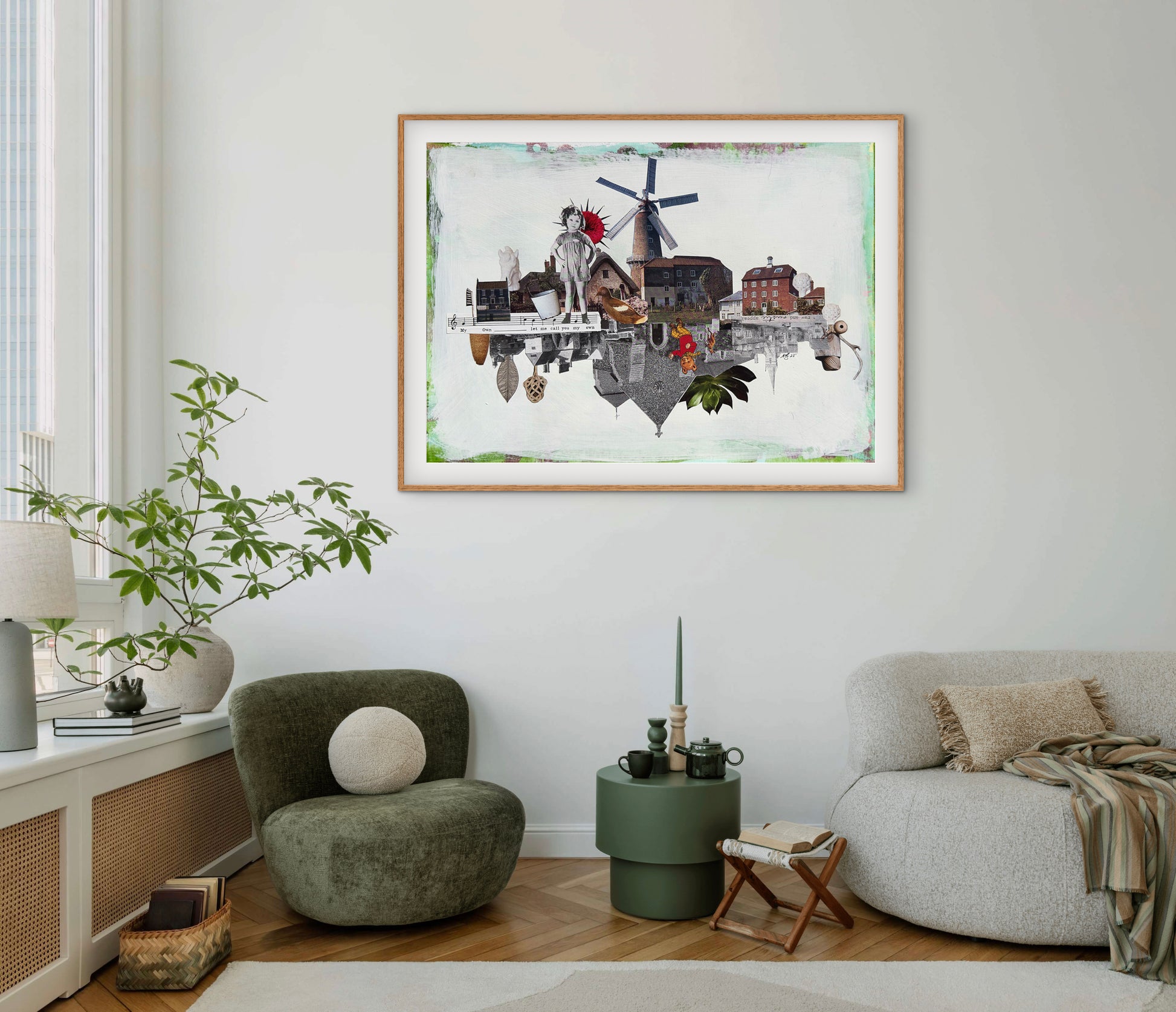 Living room with a framed artwork of a village scene on the wall.