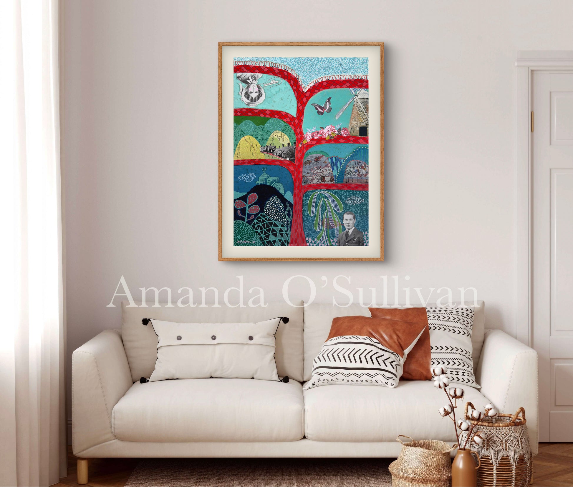 Colorful abstract art piece on a wall above a white sofa with decorative pillows.