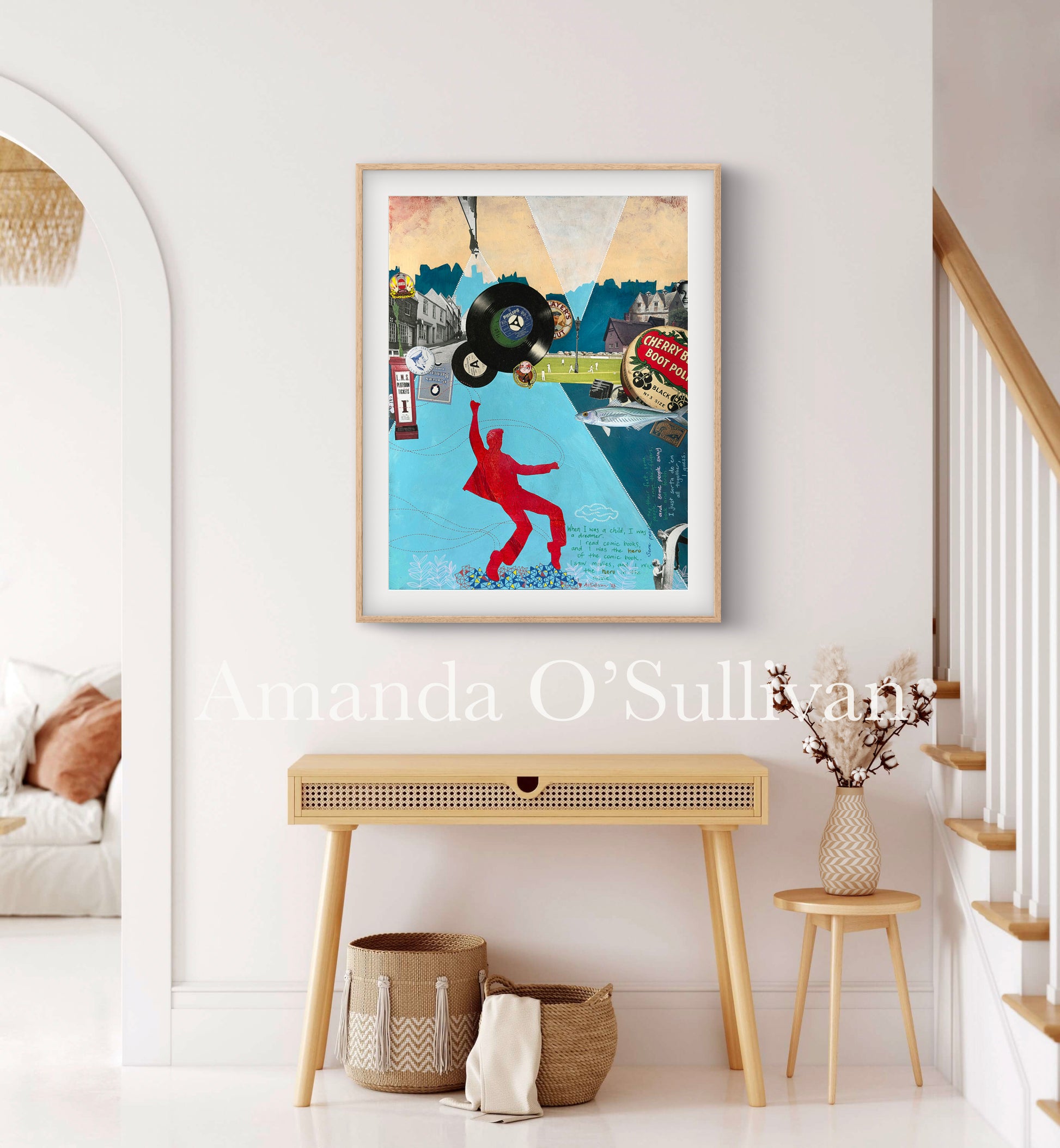 Framed artwork of a dancer with a record on a wall in a home setting.
